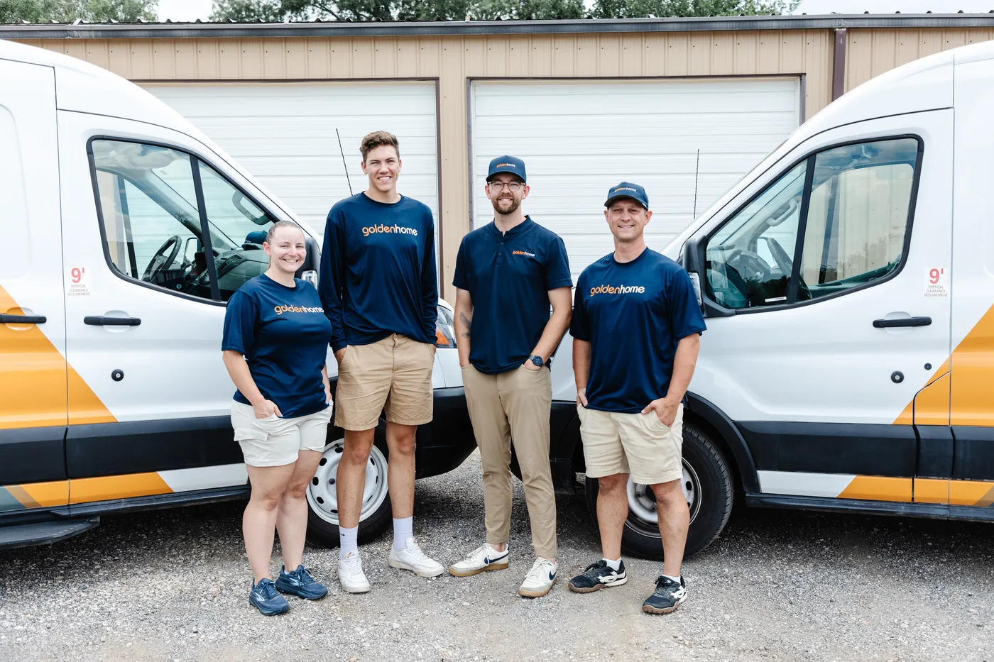 GoldenHome Club team standing together in front of a service van