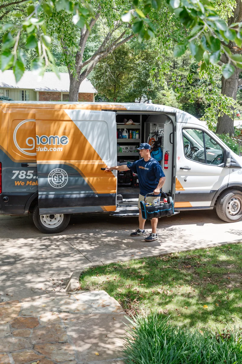 GoldenHome technician closing the van door before approaching a customer's home